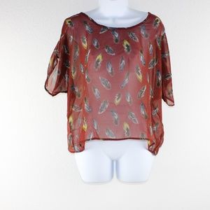 Red transparent blouse with feathers